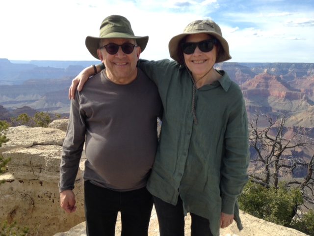 David and a woman in sun hats at a Grand Canyon overlook