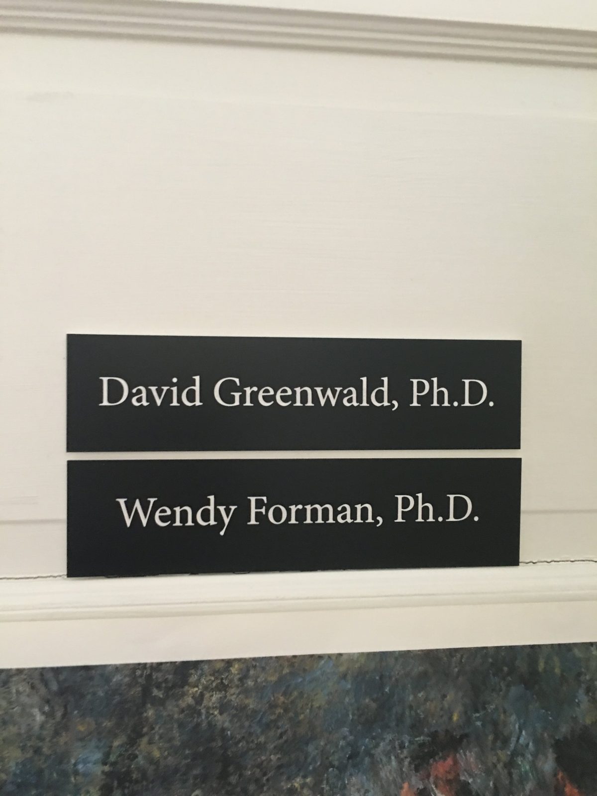 Office nameplates reading David Greenwald, Ph.D. and Wendy Forman, Ph.D.