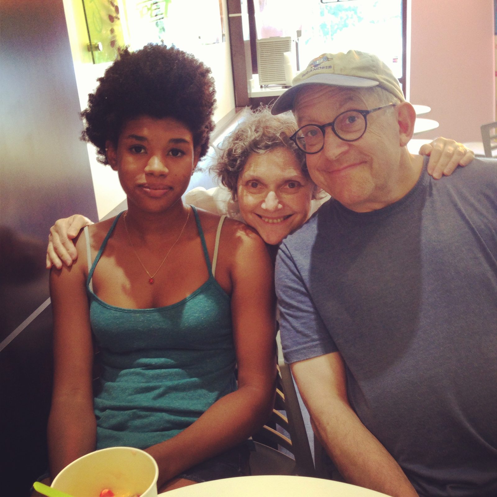 David and a woman with a young woman at a frozen yogurt shop
