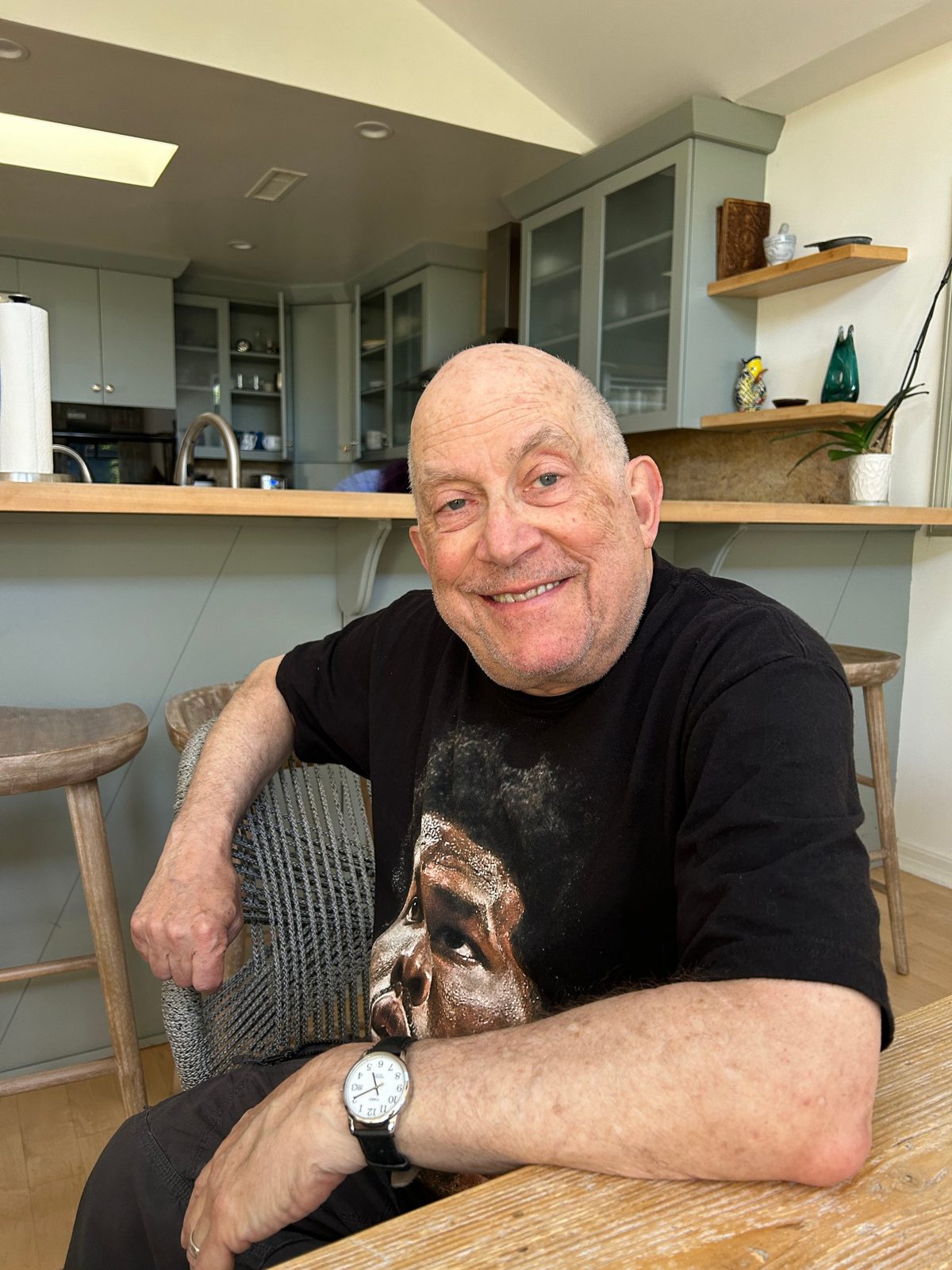 David smiling at a kitchen table